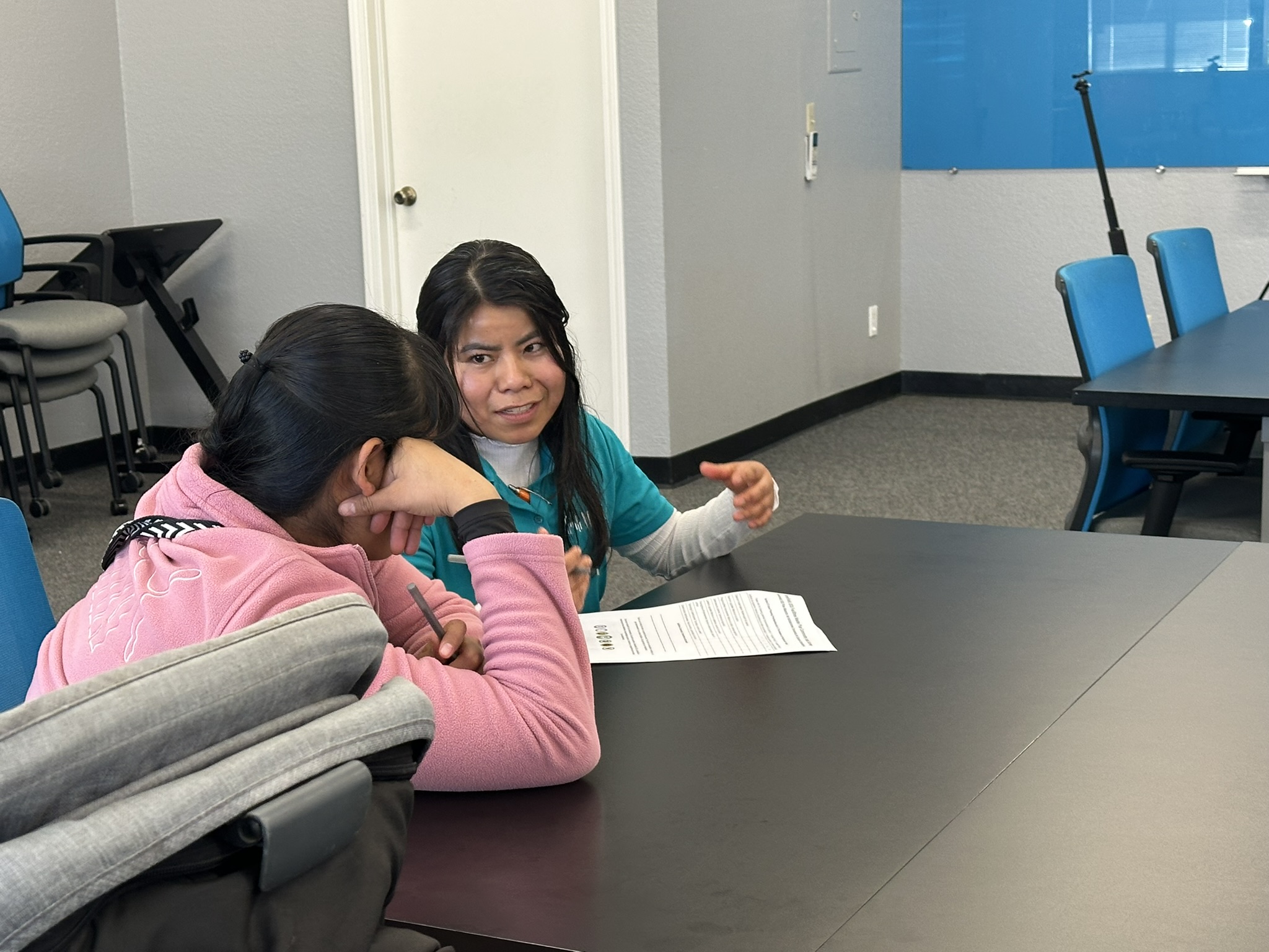 Nurbli interpreter helping parent one-on-one